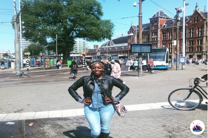 Stopping for a pose outside Amsterdam Centraal Station photo by Sally