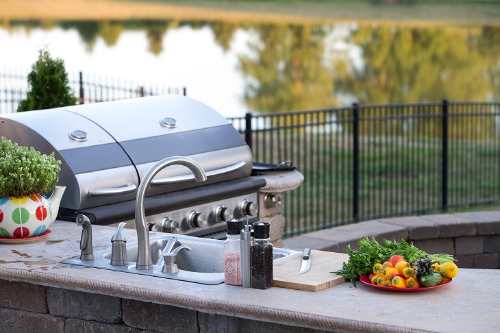 Preparing a healthy meal on outdoor natural gas grill 